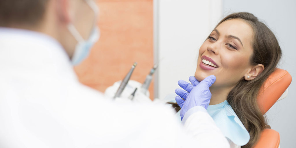 dental patient consulting with dentist before treatment